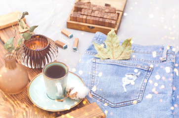 A tray with various objects stands on the bed.