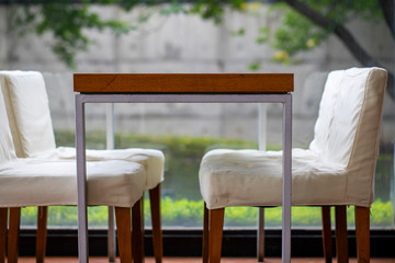 Simple and stylish restaurant, wood table and chairs, elegant and elegant