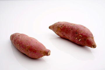 Japanese sweet potatoes on white isolated background