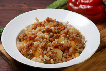 pasta with soy meat in tomato sauce and fried vegetables