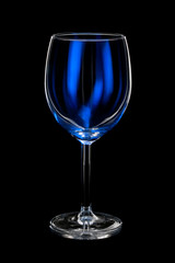 empty wine glass with blue light on black background