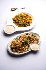 Broken wheat or Daliya Upma, served in a bowl. selective focus