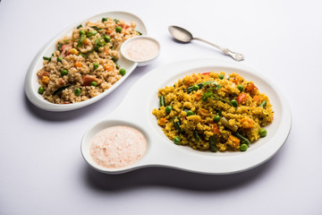 Broken wheat or Daliya Upma, served in a bowl. selective focus