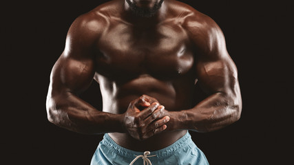 Fototapeta na wymiar Well fir athletic body of african male bodybuilder