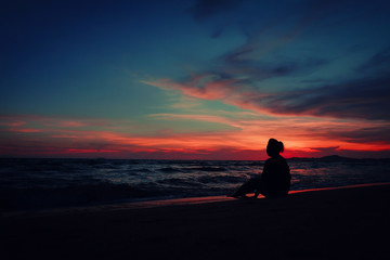 silhouette of woman at sunset