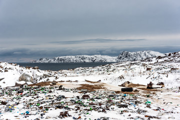 Illegal trash dump in the Arctic snow polluting the pristine environment
