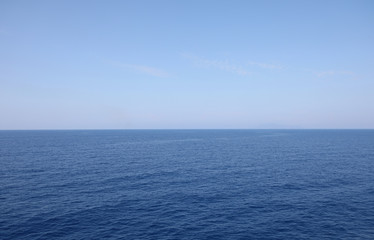 blue water of the ocean and the clear sky