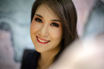 Fototapeta premium Close-up business woman selfie and smile portrait in the offices.