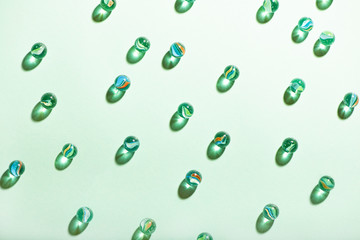 Little glass balls on mint background.