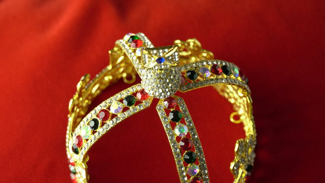 Gold crown with luxury color jewels and diamonds. With reflection and lights sparks.