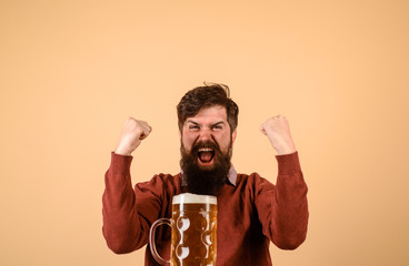 Oktoberfest. Beer pub and bar. Brewer. Craft beer at restaurant. Excited man drinks beer at pub. Bearded man hold glass with beer. Alcohol.