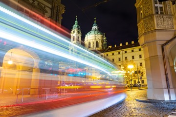 Fototapeta na wymiar view on baroque church and night traffic in Prague, Czech republic