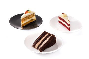 Assortment of sweet cake slices. Chocolate, carrot and velvet cake slices isolated on white background