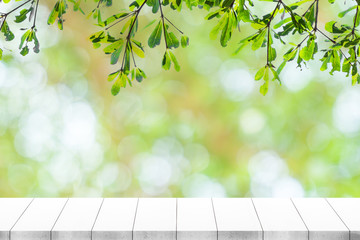 Empty white table and blurred garden bokeh background. mock up for display or montage of product, Business presentation.