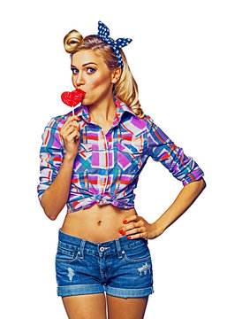 Surprised woman eating heart shape lollipop. Girl in pin up cloth. Blond model at retro fashion and vintage concept. Isolated over white background. Raster illustration.