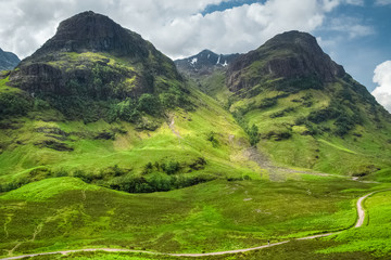 Spectacular view over Aonach Dubh and Gearr Aonach from Glencoe valley on a sunny summer day, Scotland, UK © David