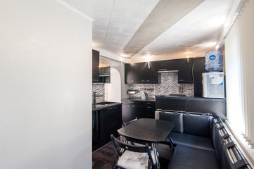 Russia, Moscow- June 23, 2018: interior room apartment. standard repair decoration in hostel. kitchen and dining room