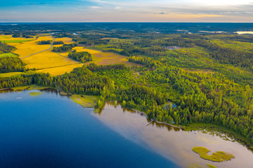 Aerial view of Pulkkilanharju Ridge, Paijanne National Park, southern part of Lake Paijanne. Landscape with drone. Blue lakes, fields and green forests from above on a sunny summer day in Finland.