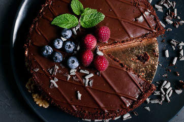 chocolate cake with fresh berries and nuts