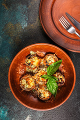 mushroom stuffed cheese (delicious baked vegetable dish, no meat) menu concept. food background. copy space. Top view