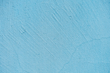 Texture of blue stone or cement wall in sunlight for pattern, background or 3D. Horizontal, close up