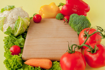 Variety of vegetables on a blackboard, top view. Vegan and healthy concept