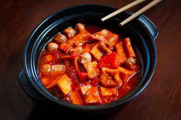 Asian spicy soup with tofu and mushrooms