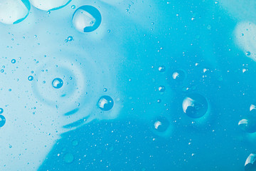 Oil bubbles in water, round abstract drops.
