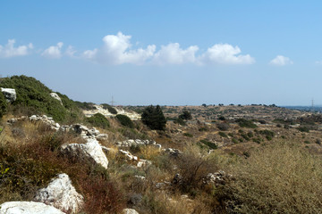 Hilly landscape and blue sky