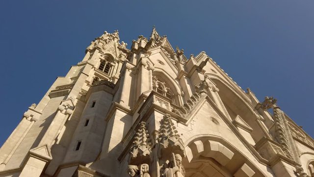 Detail shot arched doorways and statues on the facade of Church of Our Blessed Lady of Sablon Brussels Belgium