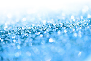 Soft de-focus backgound. Blue glitter shine dots confetti. Abstract light blink sparkle.
