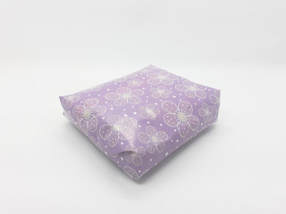Present Gift with Purple Artistic Color Floral Wrap in White Isolated Background