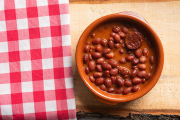 Dish of red beans in clay pot.
