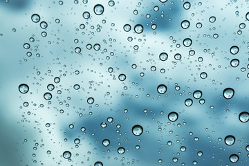 Rain on the window, natural skin of the rain The natural form of rainwater on a sky background.