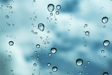 Rain on the window, natural skin of the rain The natural form of rainwater on a sky background.