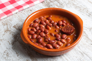 Dish of red beans in clay pot.