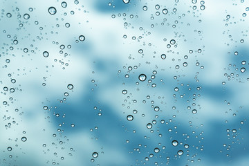 Rain on the window, natural skin of the rain The natural form of rainwater on a sky background.