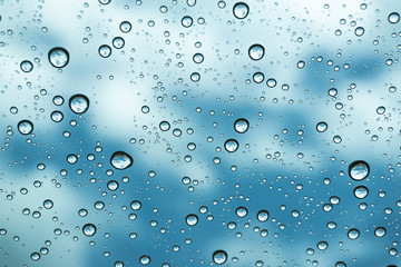 Rain on the window, natural skin of the rain The natural form of rainwater on a sky background.