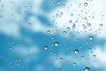 Rain on the window, natural skin of the rain The natural form of rainwater on a sky background.