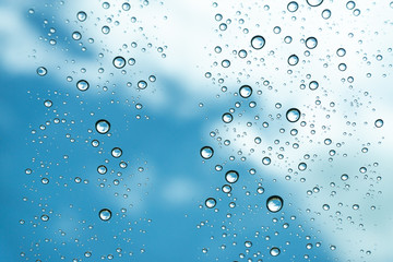 Rain on the window, natural skin of the rain The natural form of rainwater on a sky background.