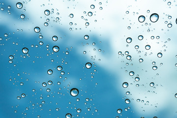 Rain on the window, natural skin of the rain The natural form of rainwater on a sky background.