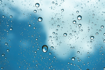 Rain on the window, natural skin of the rain The natural form of rainwater on a sky background.