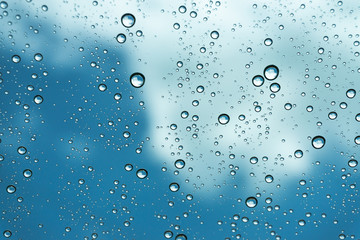 Rain on the window, natural skin of the rain The natural form of rainwater on a sky background.