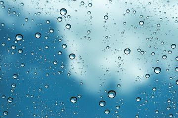 Rain on the window, natural skin of the rain The natural form of rainwater on a sky background.