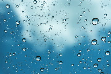 Rain on the window, natural skin of the rain The natural form of rainwater on a sky background.