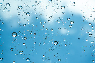 Rain on the window, natural skin of the rain The natural form of rainwater on a sky background.