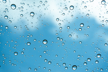 Rain on the window, natural skin of the rain The natural form of rainwater on a sky background.