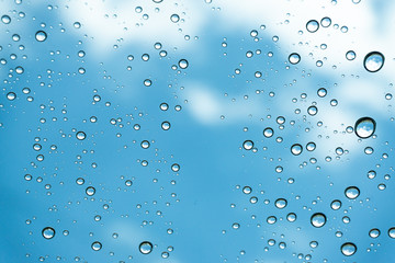 Rain on the window, natural skin of the rain The natural form of rainwater on a sky background.