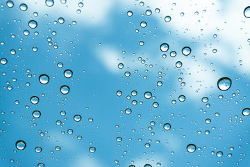 Rain on the window, natural skin of the rain The natural form of rainwater on a sky background.
