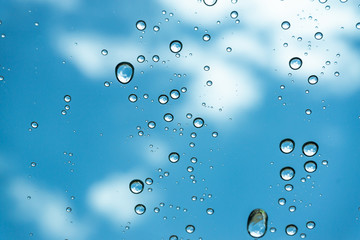 Rain on the window, natural skin of the rain The natural form of rainwater on a sky background.